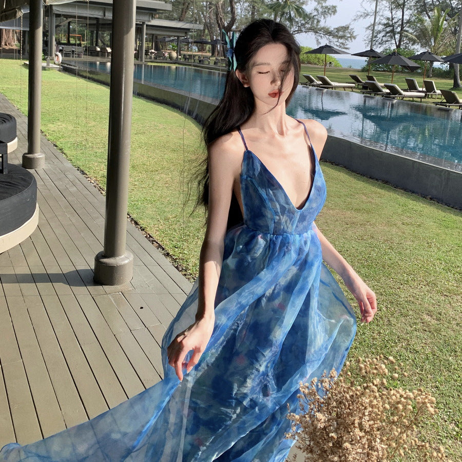 2025 Blue pure desire floral suspender dress female summer seaside vacation atmosphere sexy backless beach fairy long dress