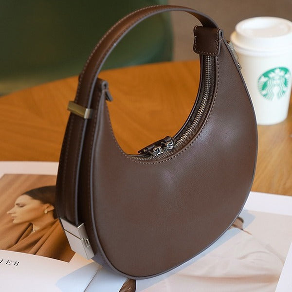 2025 spring and summer new Korean niche cowhide crescent bag, underarm bag, semi-round moon bag, shoulder handheld women's bag new