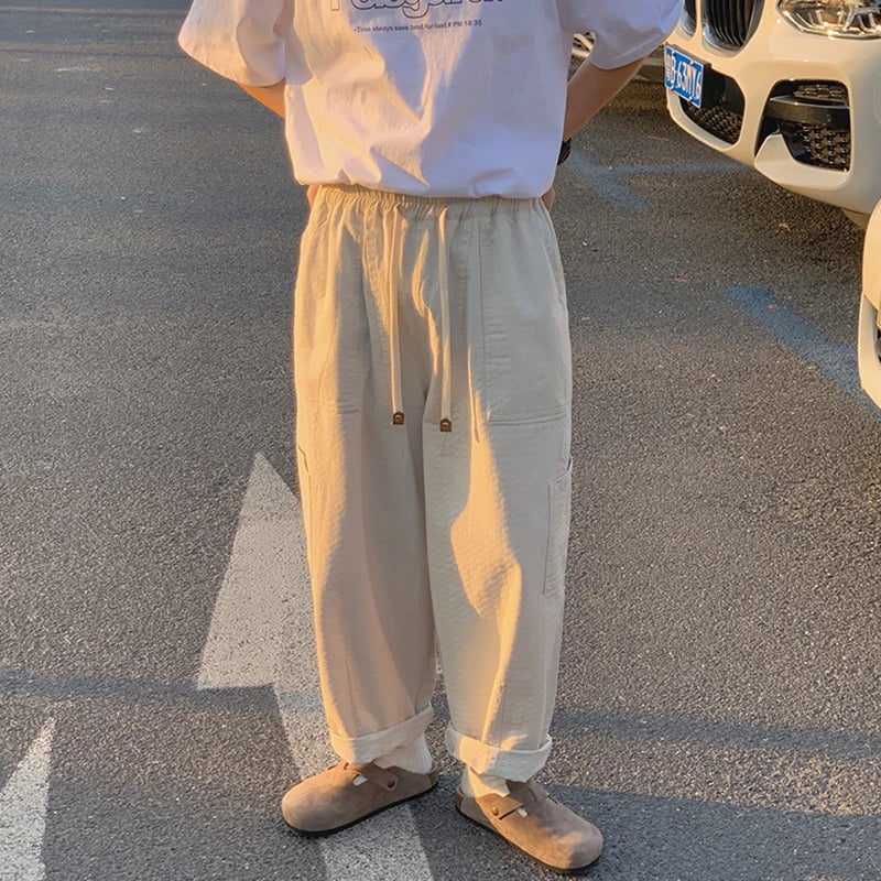 sanyamk - Casual Pants Men Oversized Loose Cargo Pants Streetwear Japanese Style Harajuku Drawstring Hombre Tooling Trousers