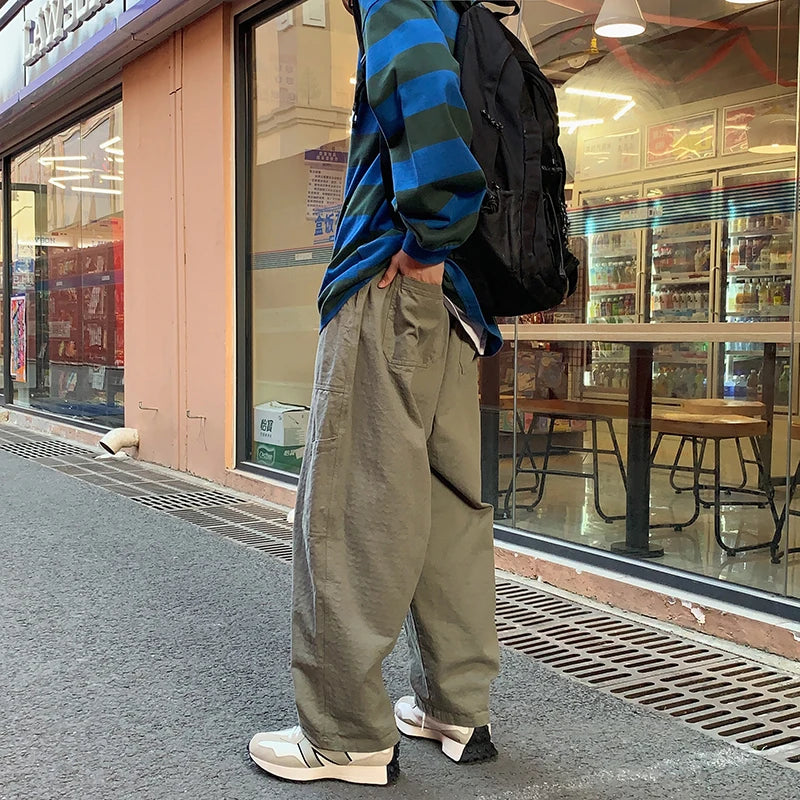 sanyamk - Casual Pants Men Oversized Loose Cargo Pants Streetwear Japanese Style Harajuku Drawstring Hombre Tooling Trousers