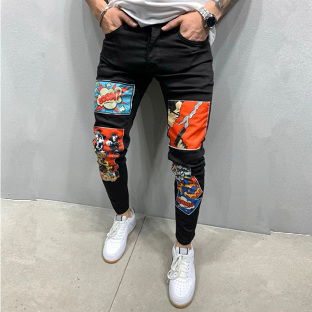 sanyamk New Fashion Mens Jeans Stretch Skinny Patchwork Cartoons Printed Black Jean Men Streetwear Denim Punk Pants Vaqueros Hombre